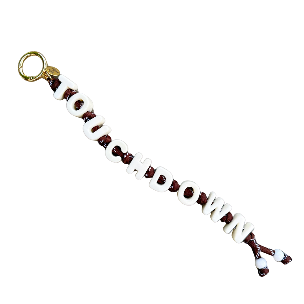 Keychain with 'TOUCHDOWN' text on a white background