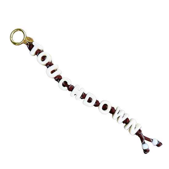 Keychain with 'TOUCHDOWN' text on a white background